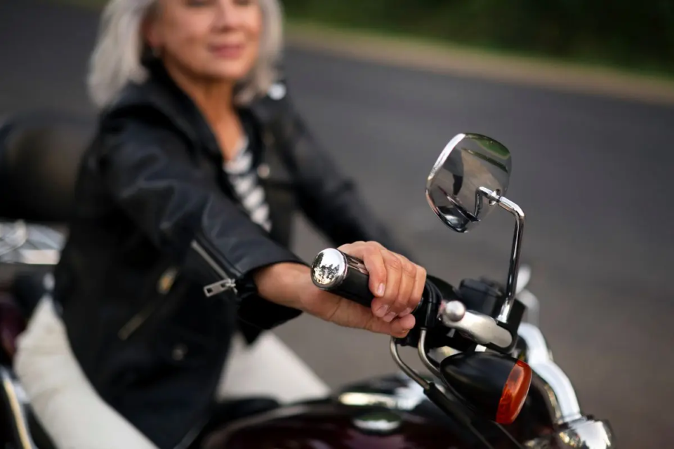 side-view-senior-woman-with-motorcycle-1790109387